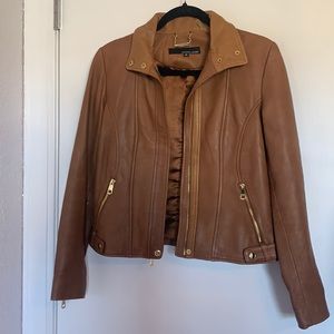 Wilson’s brown leather jacket